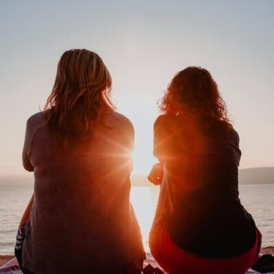 women sitting sunset (1)